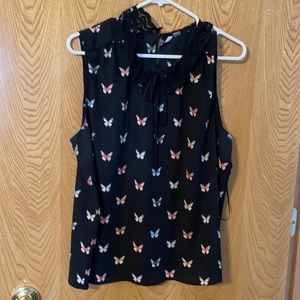 Sleeveless blouse size L